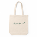 Beige tote bag with 'dias do sol' text on a white background